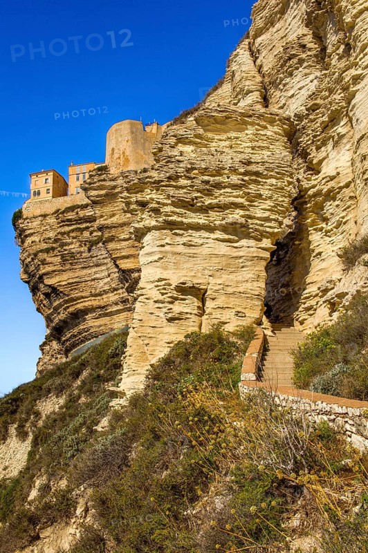 Steep coast of Bonifacio with old town on a limestone plateau