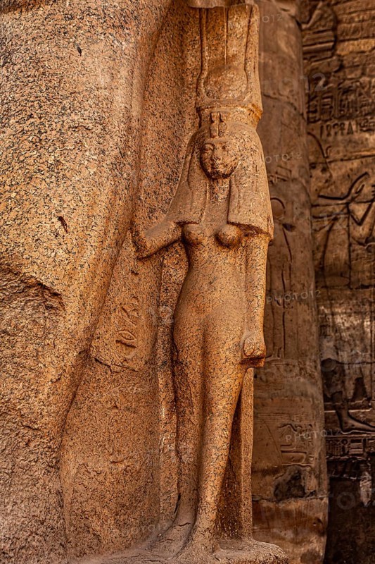 Figure of the Royal Wife Nefertari on the right leg of Ramses II. Luxor Temple