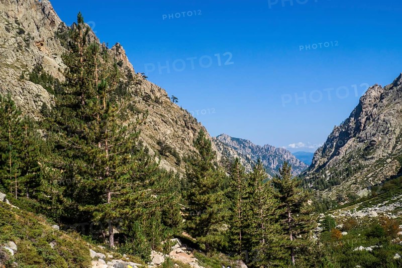 Hiking to the mountain lake Lac de Melo