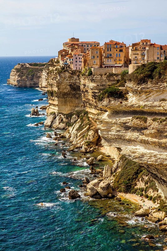 Steep coast of Bonifacio with old town on a limestone plateau