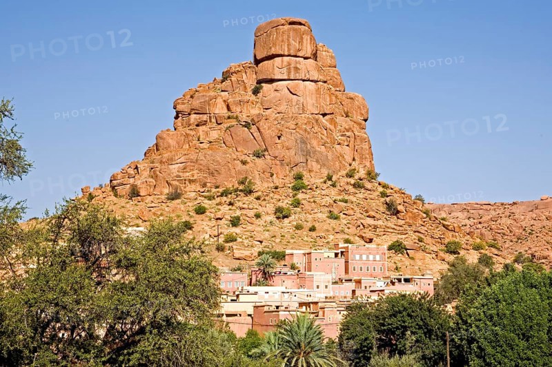 Village in front of bizarre granite rocks