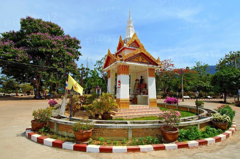 Spiritual Buddhist ghost house Ghost house in centre of roundabout in village