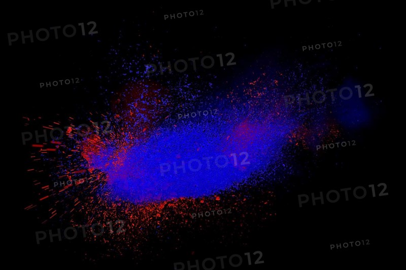 Freeze motion of red and blue powder exploding