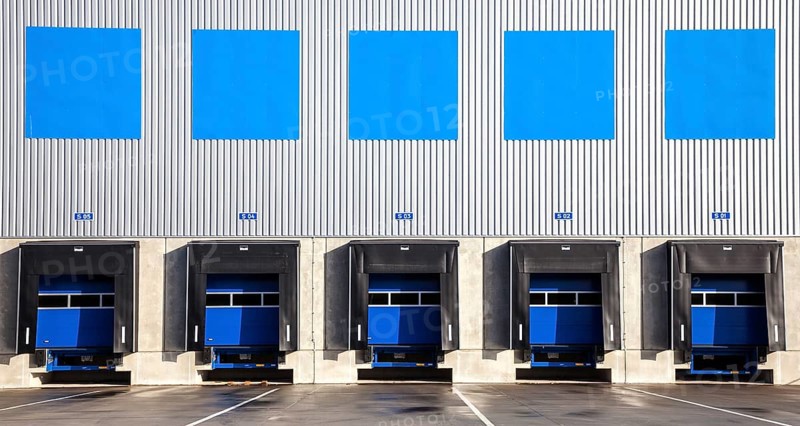 5 blue loading ramps at warehouse