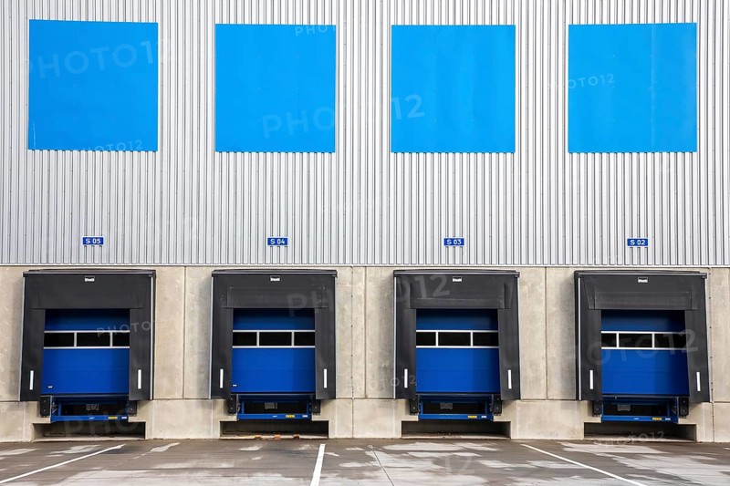 4 blue loading ramps at warehouse