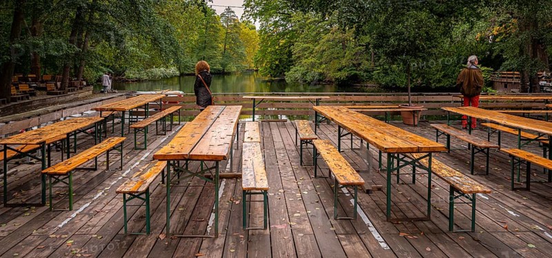Tables and benches in an empty beer garden in the park