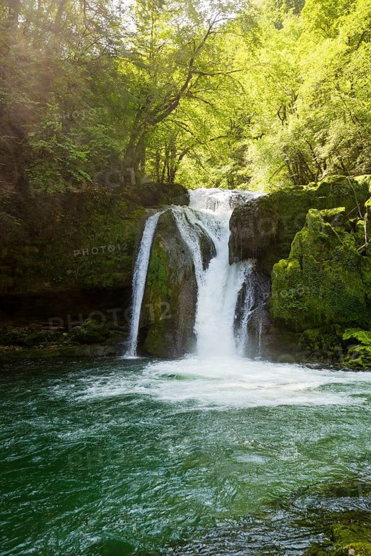 Waterfall and mossy rocks