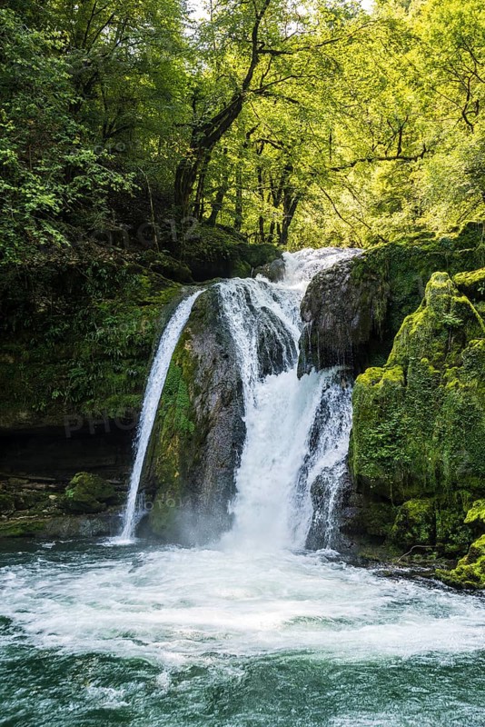 Waterfall and mossy rocks