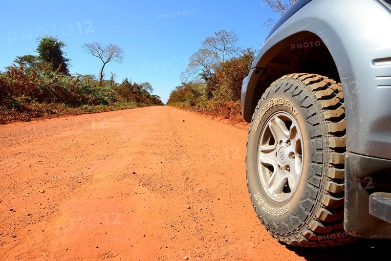 Tyres of an off-road vehicle on a dirt road