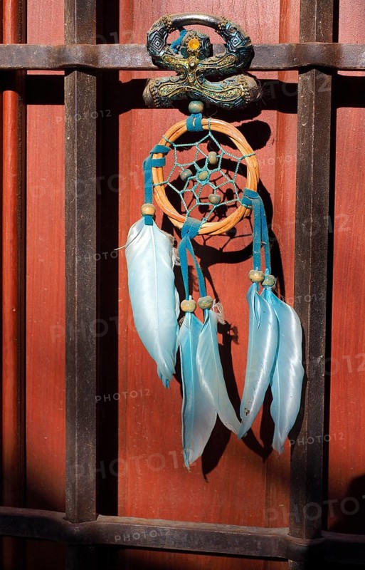 Andalusian lucky charm Indalo and dream catcher on front door