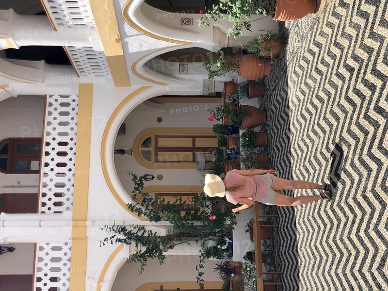 Tourist standing in a courtyard