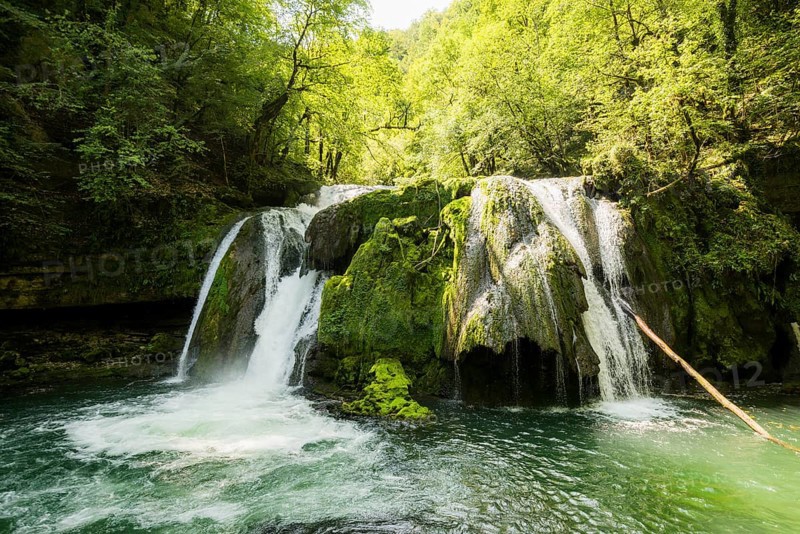 Waterfall and mossy rocks