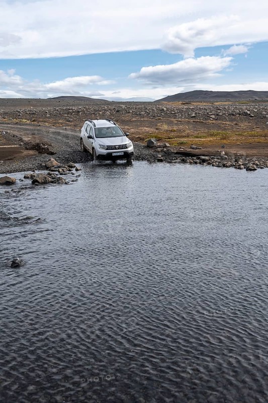 Dacia Duster 4x4 car crossing a river