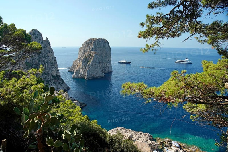 Rocky coast with boats on the sea