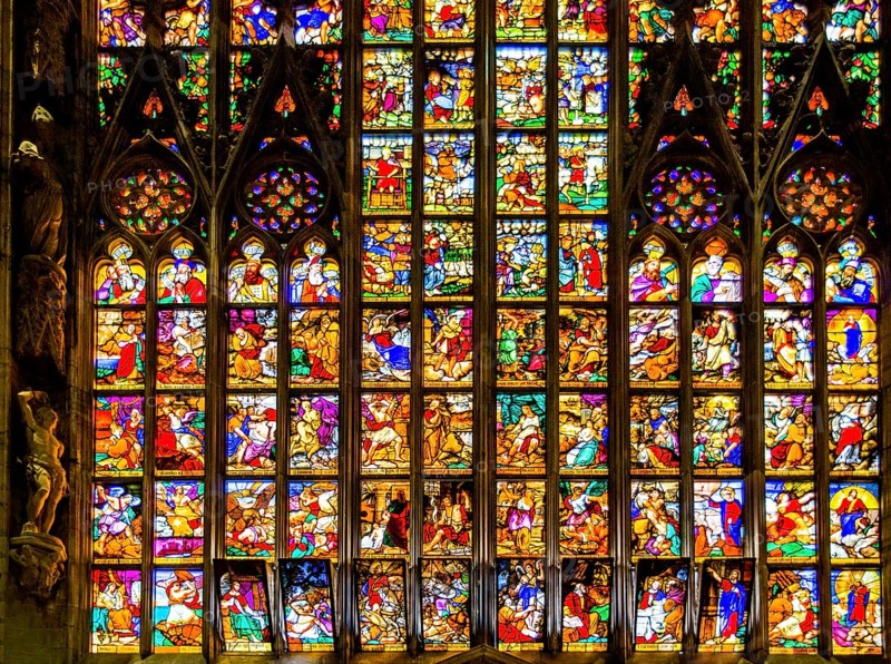 14th century Milan Cathedral stained glass windows in white marble