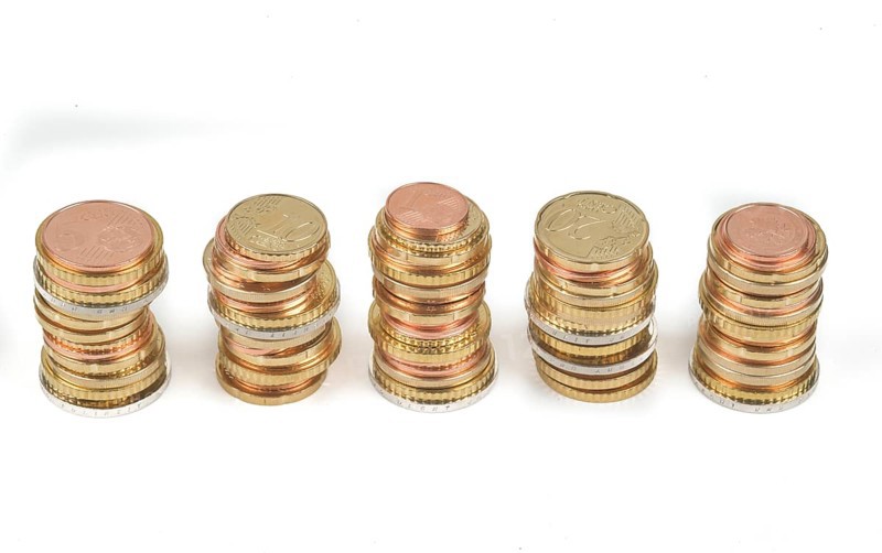 Stack of cent coins and euro coins