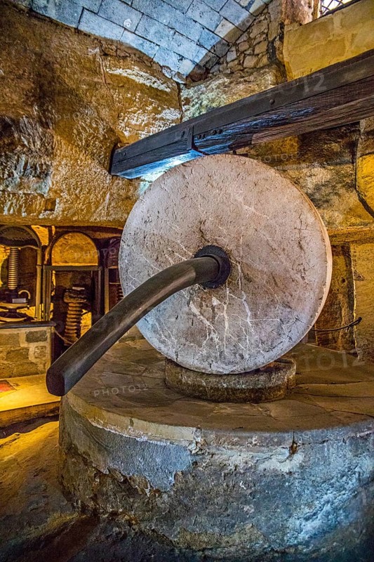 Underground oil mill with millstones