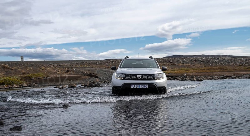 Dacia Duster 4x4 car crossing a river