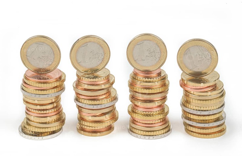 Stack of cent coins and euro coins
