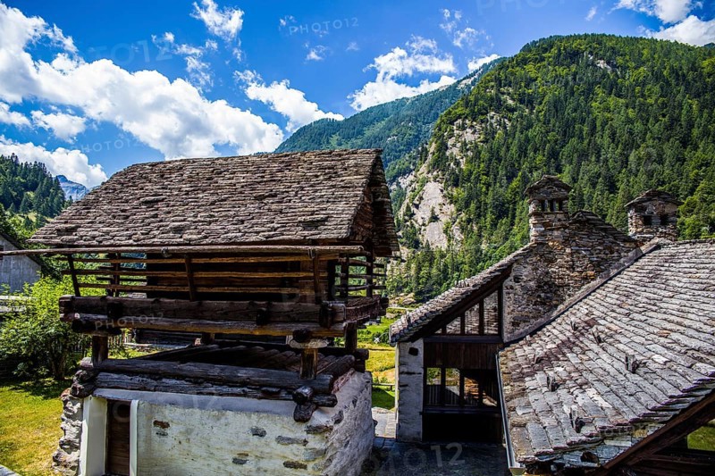 Characteristic old buildings in stone and wood in the hamlet of Mogno