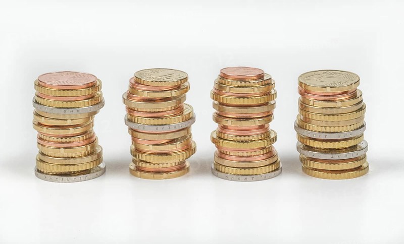 Stack of cent coins and euro coins