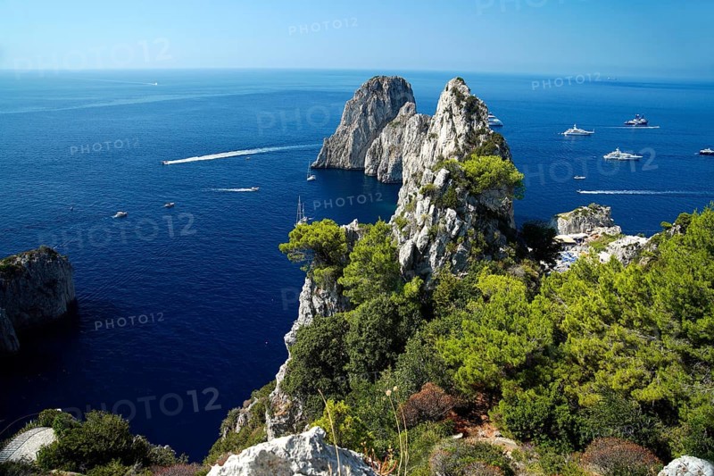 Rocky coast with boats on the sea