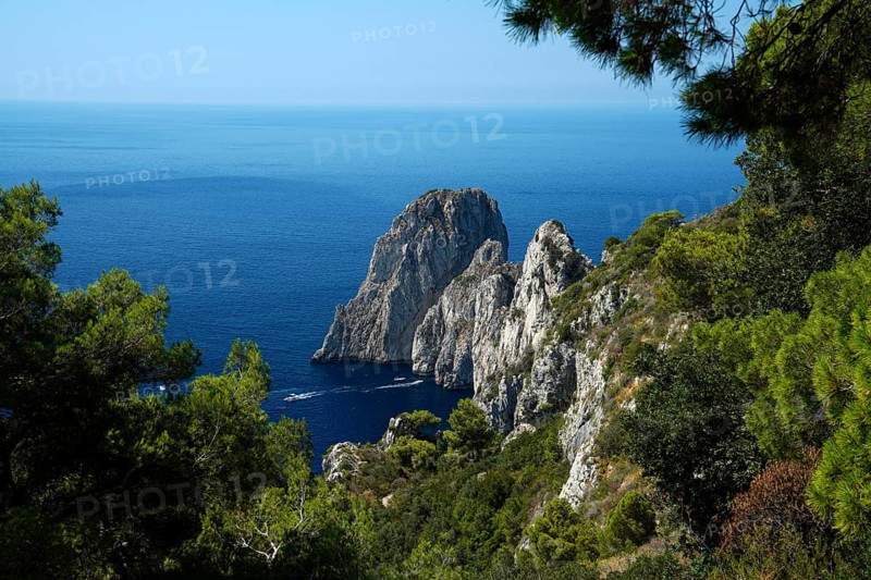 Rocky coast with boats on the sea