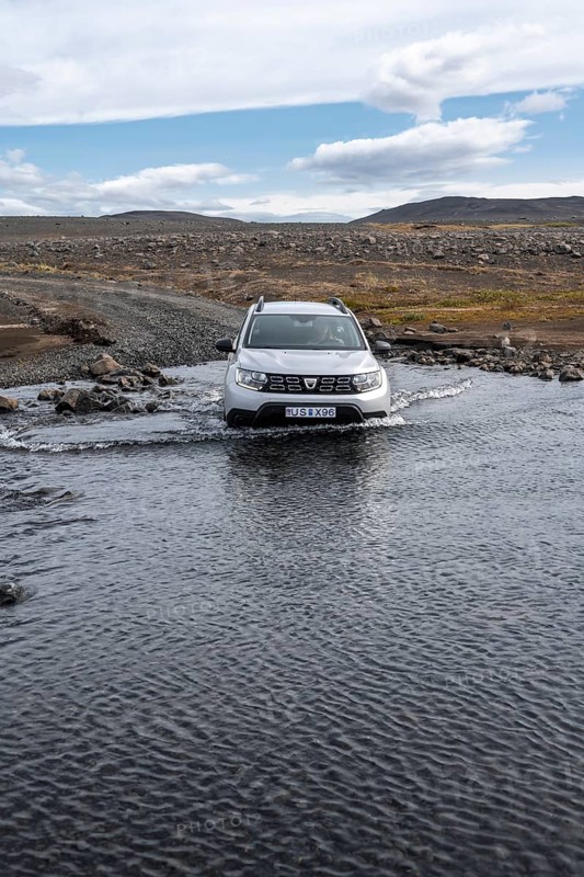 Dacia Duster 4x4 car crossing a river