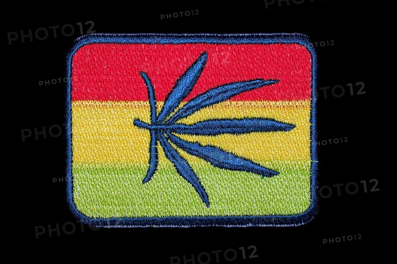 Patch with Jamaican national colours and a hemp leaf in the centre