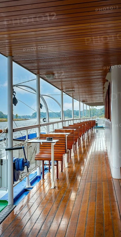 Wood-panelled outside deck of an excursion boat