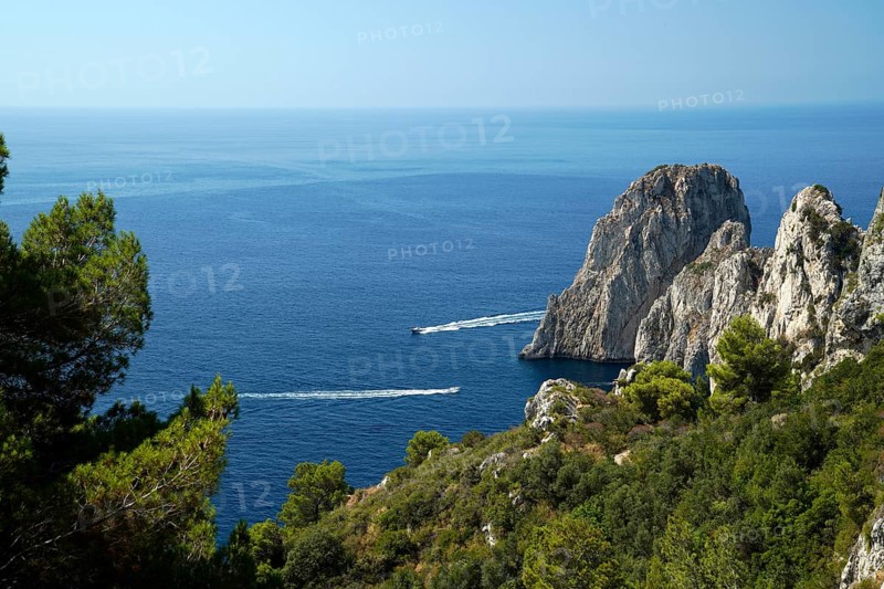 Rocky coast with boats on the sea