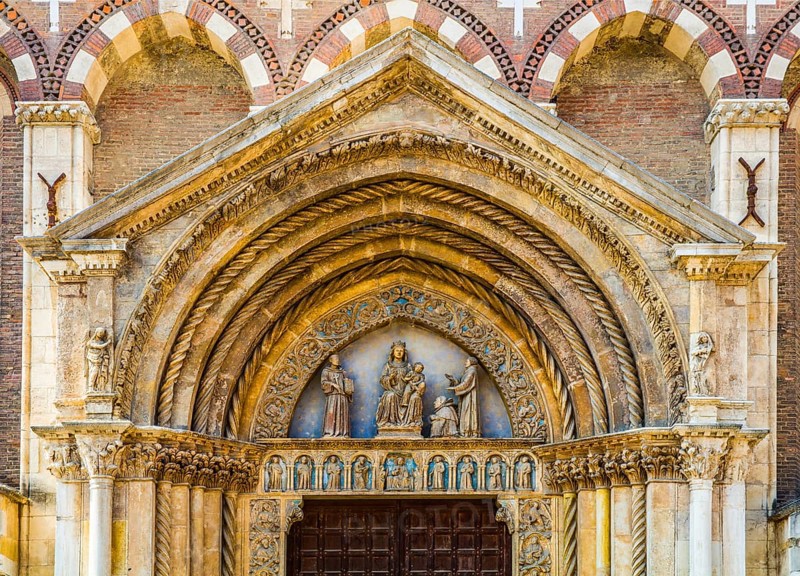 Magnificent lunette of the portal in front of which Peter the Dwarf kneels
