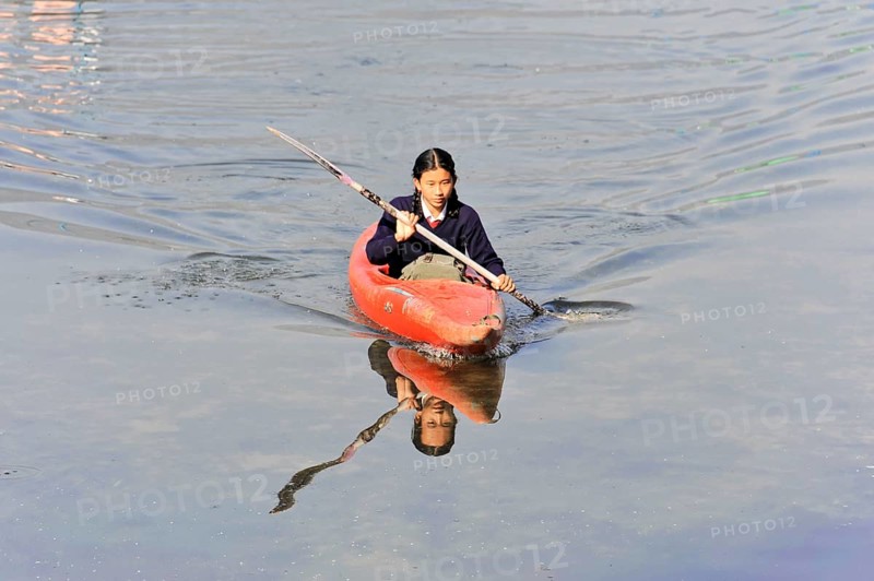Schoolgirl with paddle boat