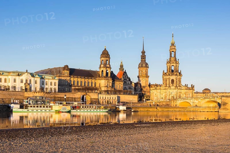 City view in the morning light with reflection in the river Elbe