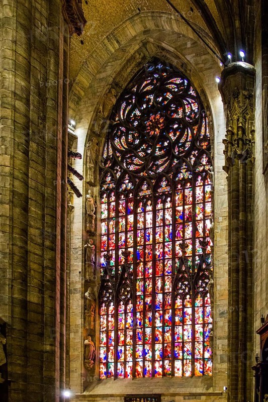 14th century Milan Cathedral stained glass windows in white marble