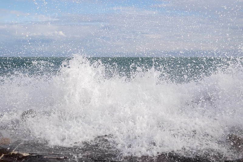 Strong swells during storm break on seawall in Sanremo
