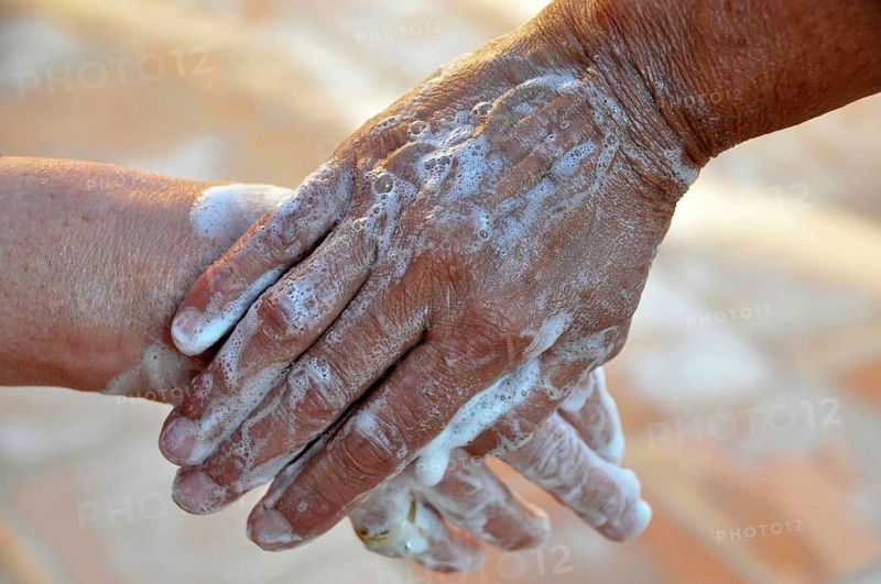 Two soapy hands