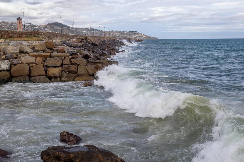 Strong swells during storm break on seawall in Sanremo