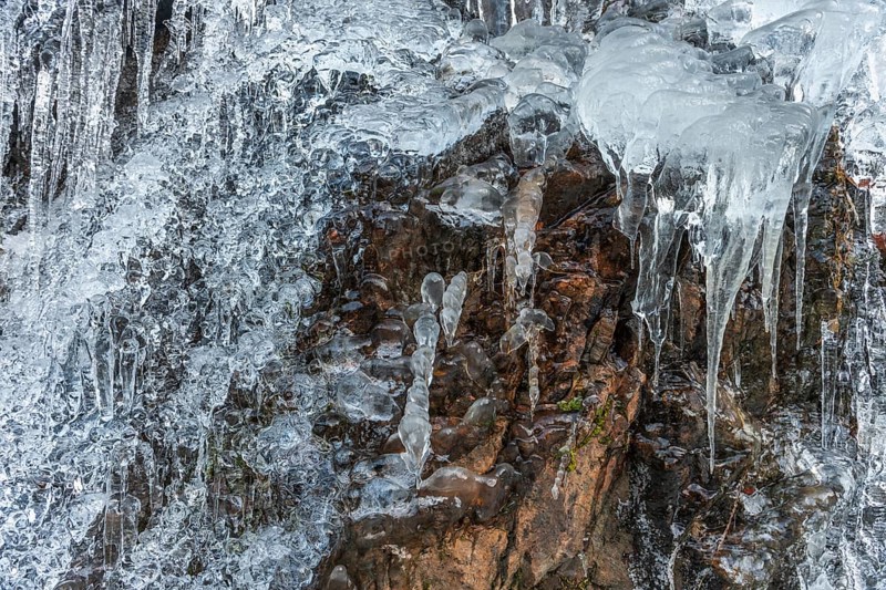 Icicles forming an icefall in the mountain in winter. France
