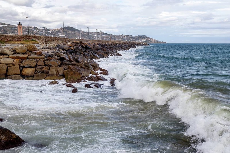 Strong swells during storm break on seawall in Sanremo