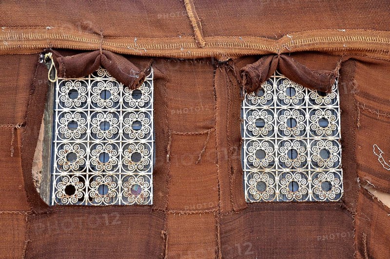 Barred windows on fixed Bedouin tent
