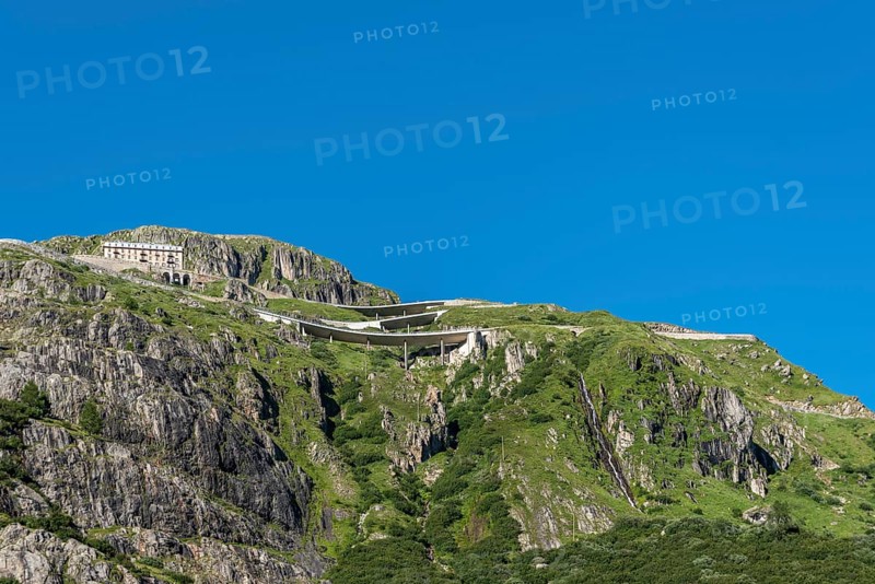 Mountain massif of the Rhone glacier with serpentines of the Furka Pass road