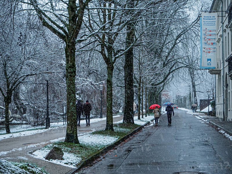 People with umbrella during snowfall