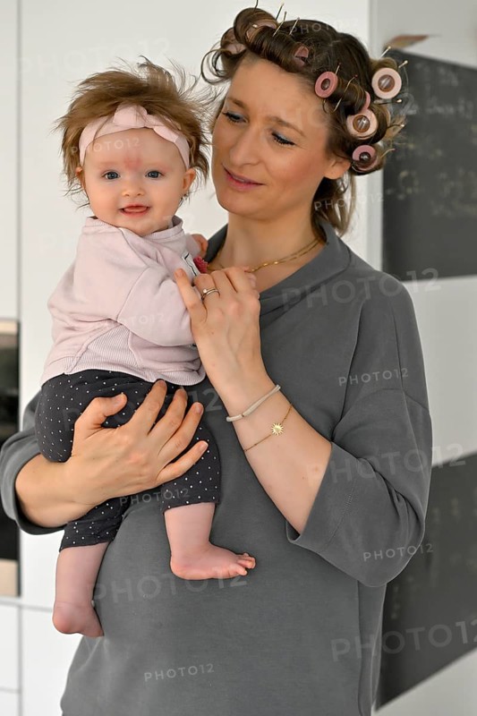 Mother with curlers in her hair