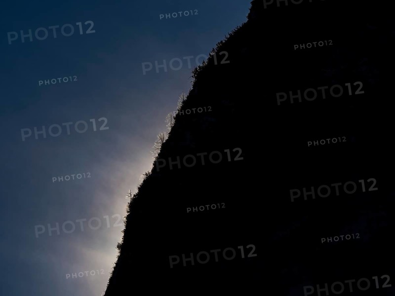 Clouds over mountain silhouette