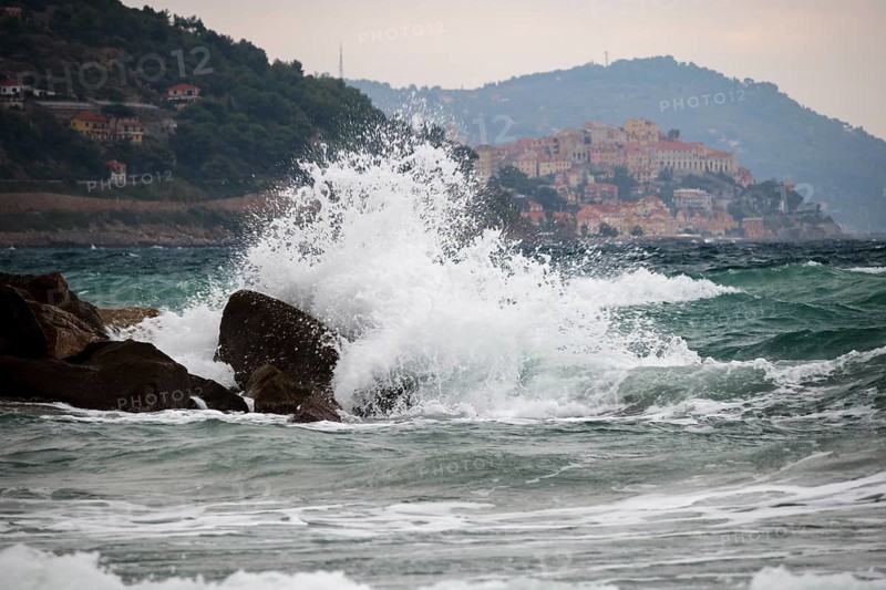 Strong swells during storm break on seawall in Sanremo