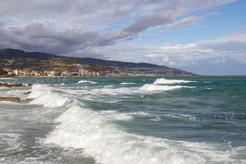 Strong swells during storm break on seawall in Sanremo