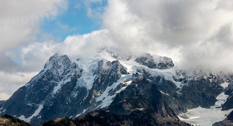 Cloudy mountain with snow and glacier