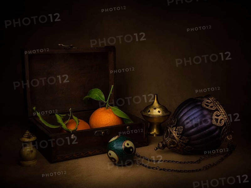 Still life with mandarins in a wooden box