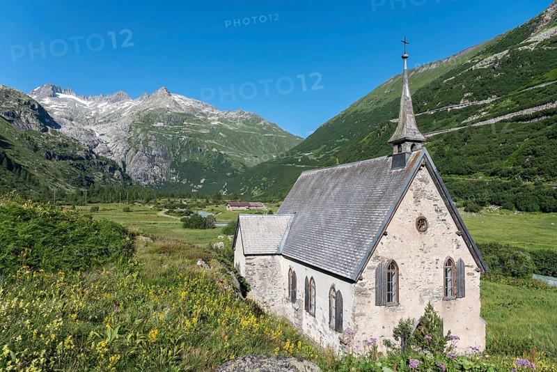 Landscape of the Rhone Valley in front of the Rhone Glacier and the Anglican Chapel in the hamlet of Gletsch